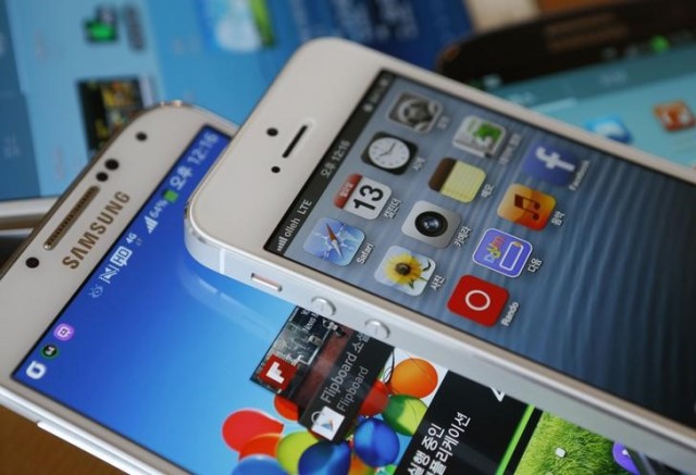 Picture illustration of Apple's iPhone 5 and Samsung Electronics' Galaxy S4 taken in Seoul